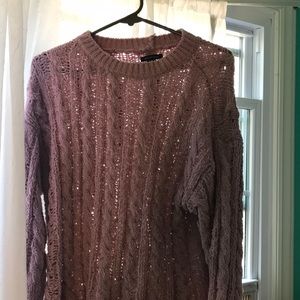 a purple sweater